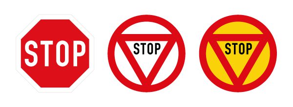 A US STOP sign versus international STOP signs, which are circular with a center triangle.