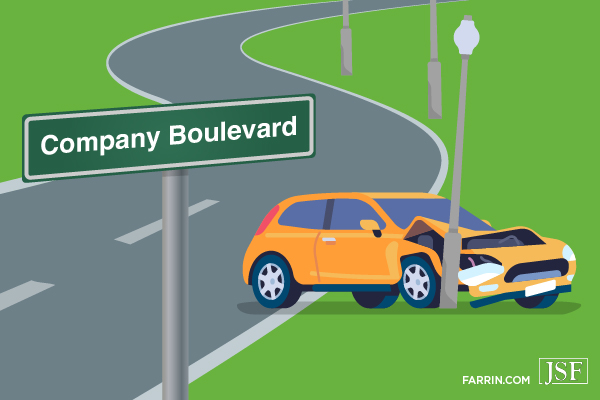 A yellow car crashing into a lamp post off the shoulder of a street called Company Boulevard.