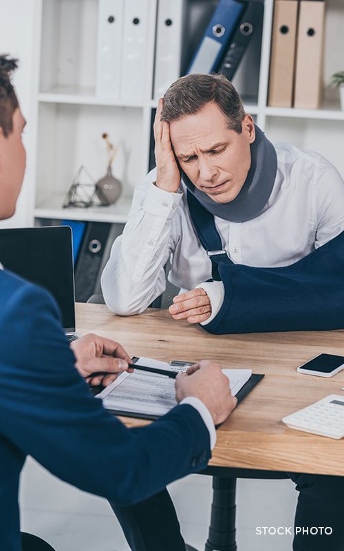 Frustrated injured man at a meeting with their adjuster.